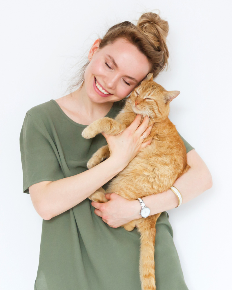 woman hugs cat