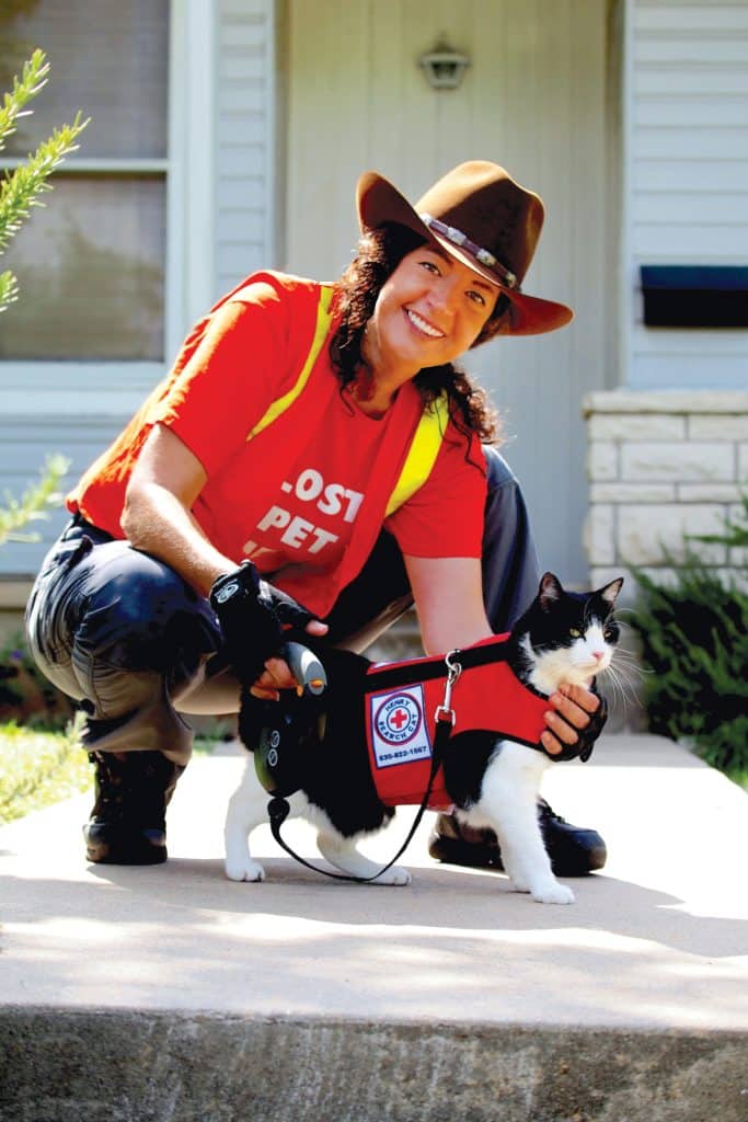 Henry the Lost Cat Finder in red vest